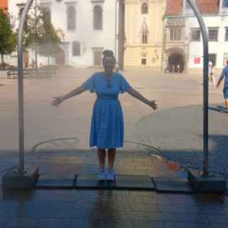 Cooling down in a spray of cold water, Main Square, Bratislava