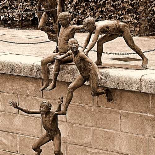 Boys Jumping In River Statue photo