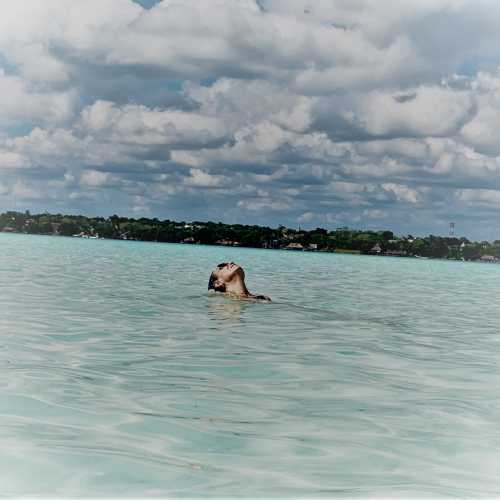 bathing in a cenote at Bacalar Mexico