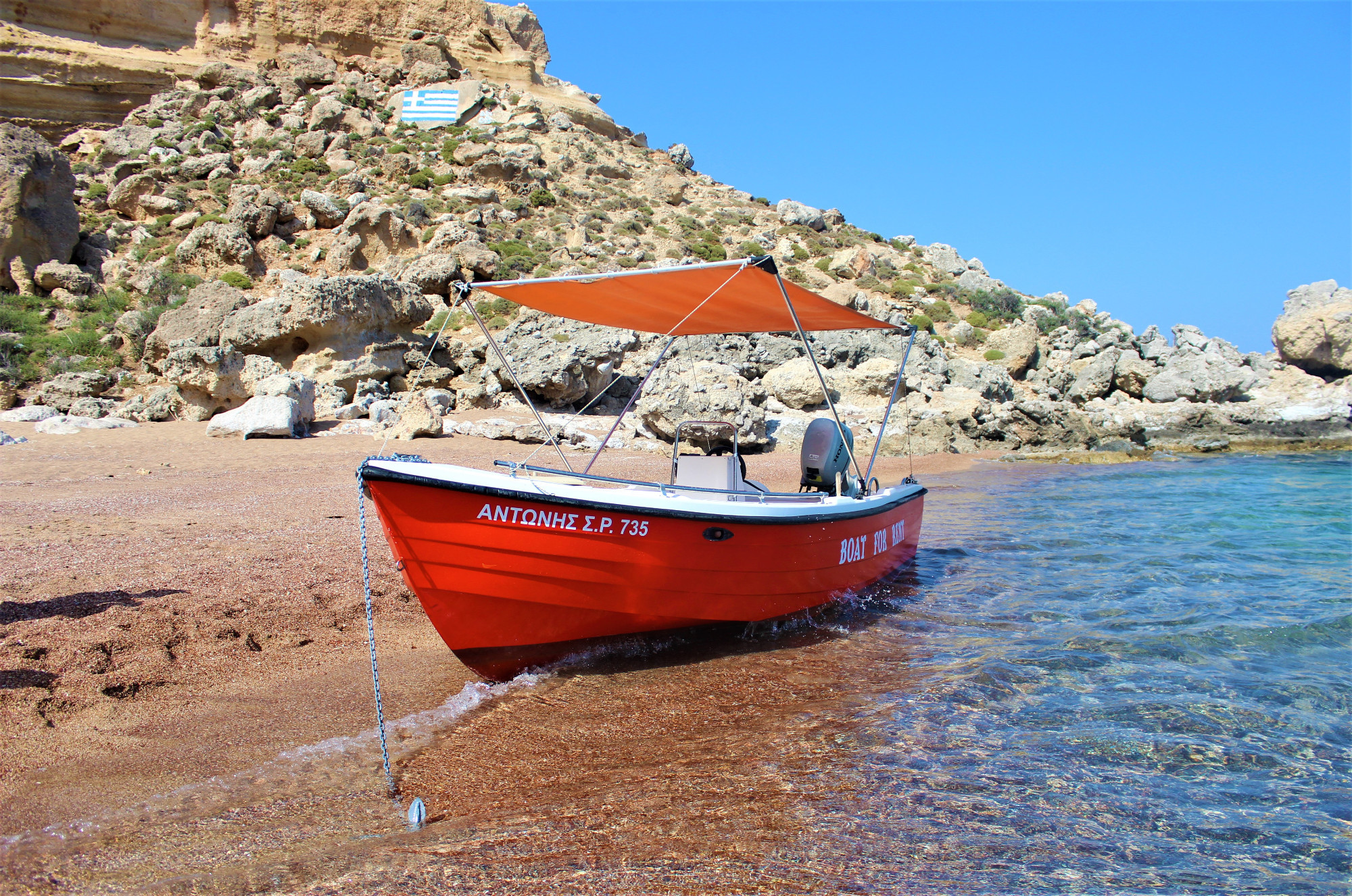 Boat on Red Sand Beach