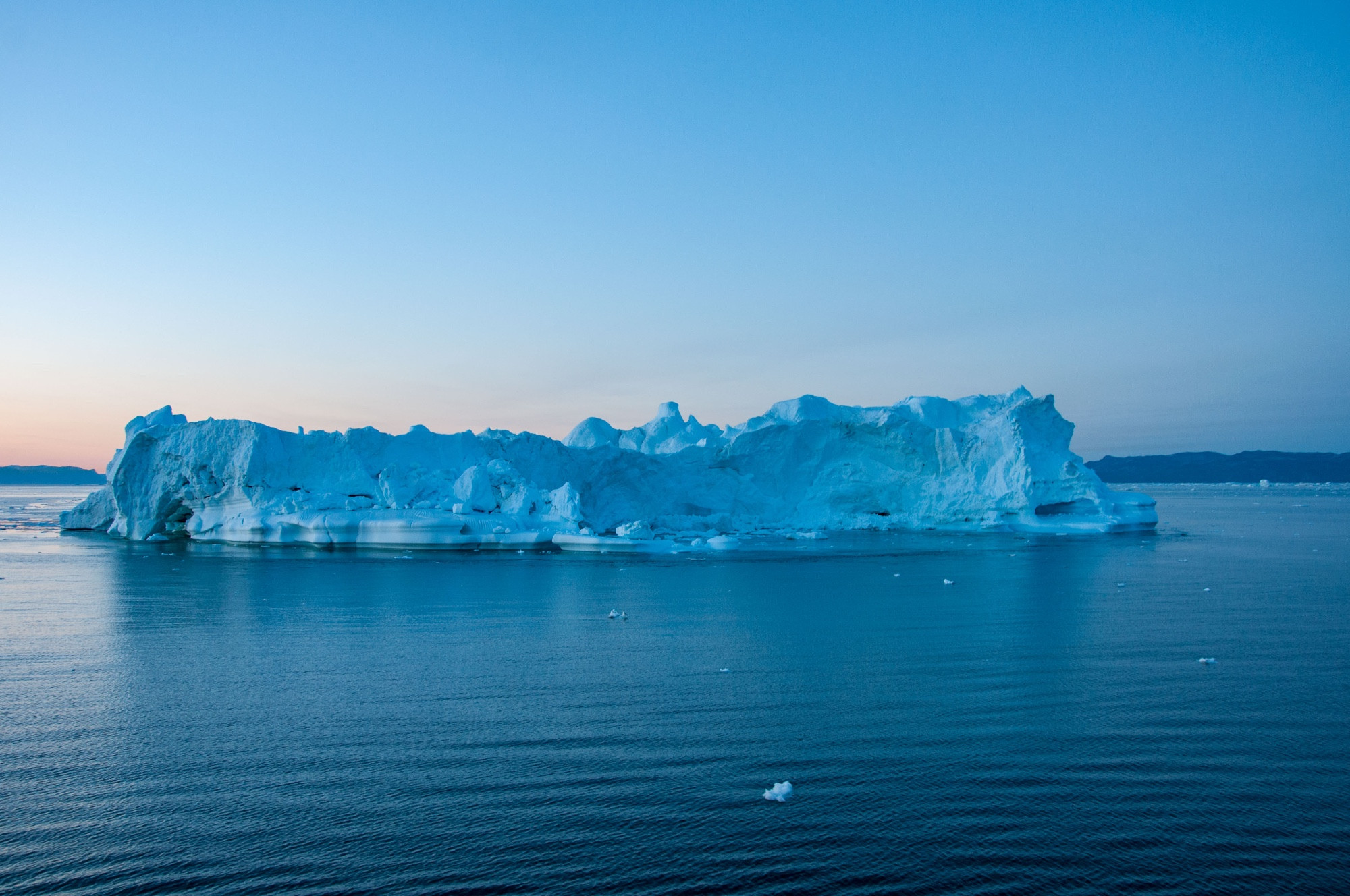 Iceberg in Ataa Sound after sun set without sunlight the ice turned to blue 
