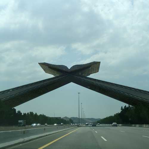 Arch of Opening Quran over Highway