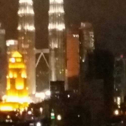 Petronas Towers, Kuala Lumpur, from hotel window at night, Malaysia 