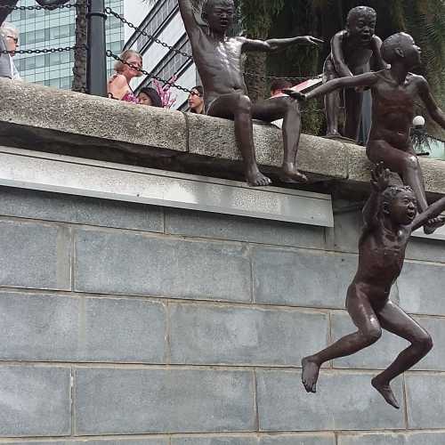 Sculpture of children jumping in the river Singapore 