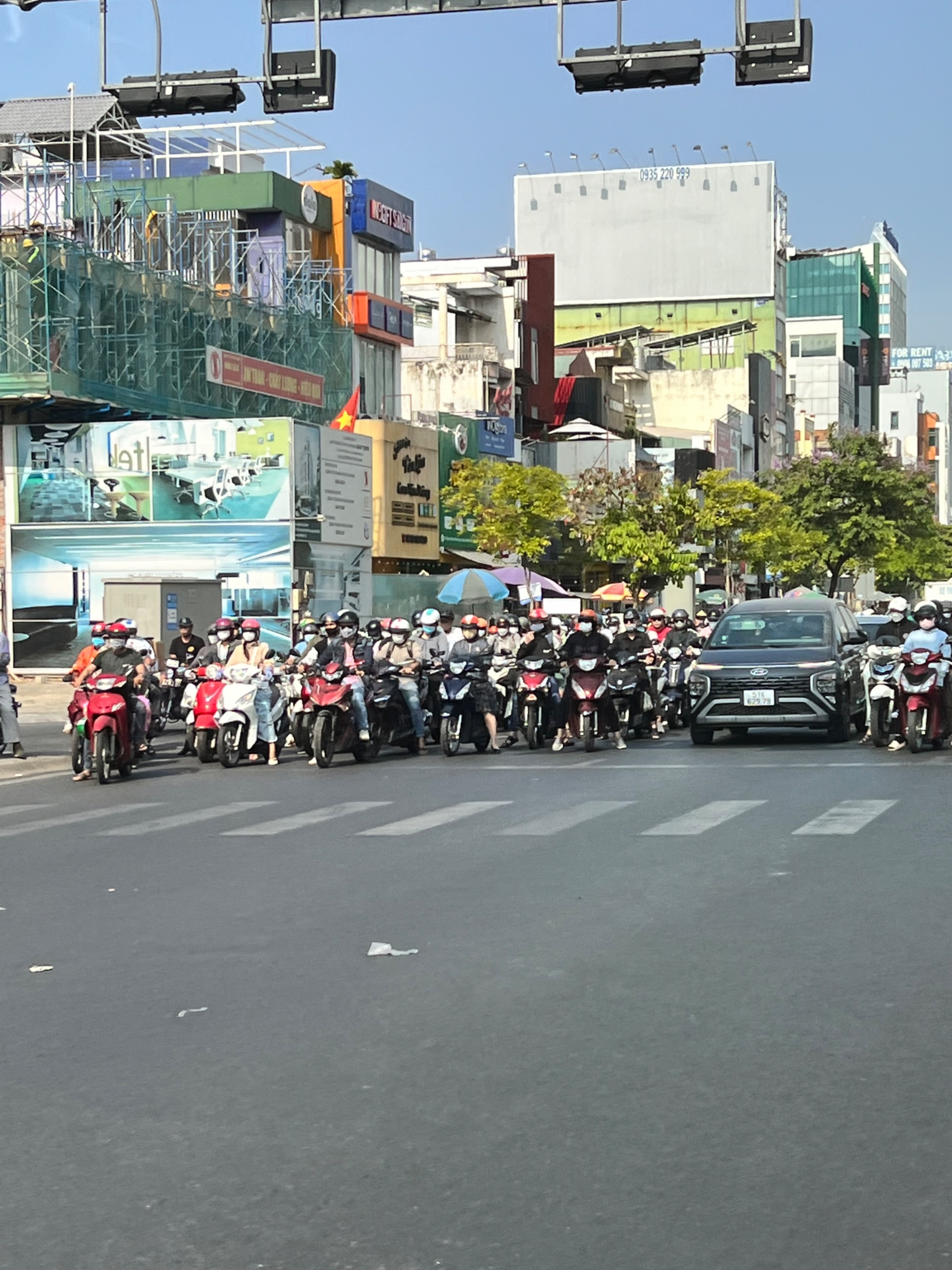 Lots and lots of motorbikes at an intersection in Ho Chi Minh City