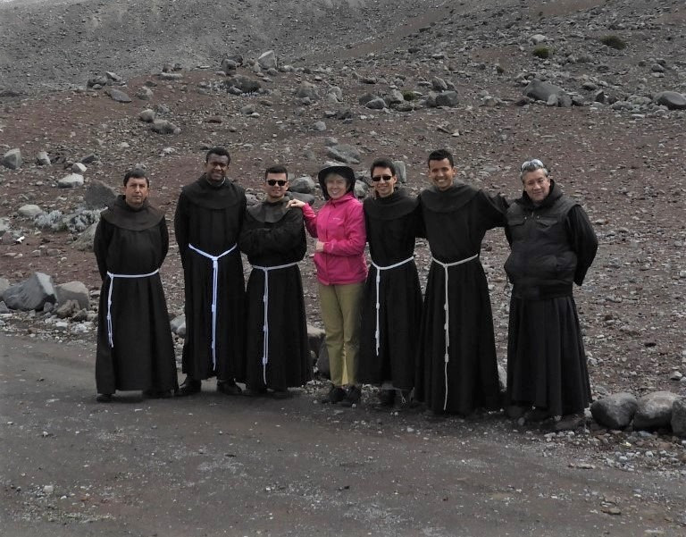 Ferda posing with priests who were on tour.
