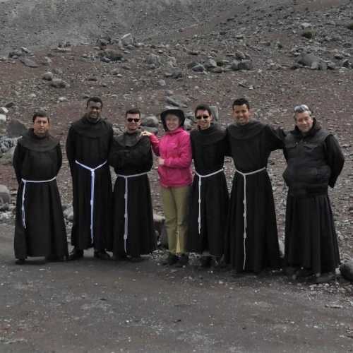 Ferda posing with priests who were on tour.