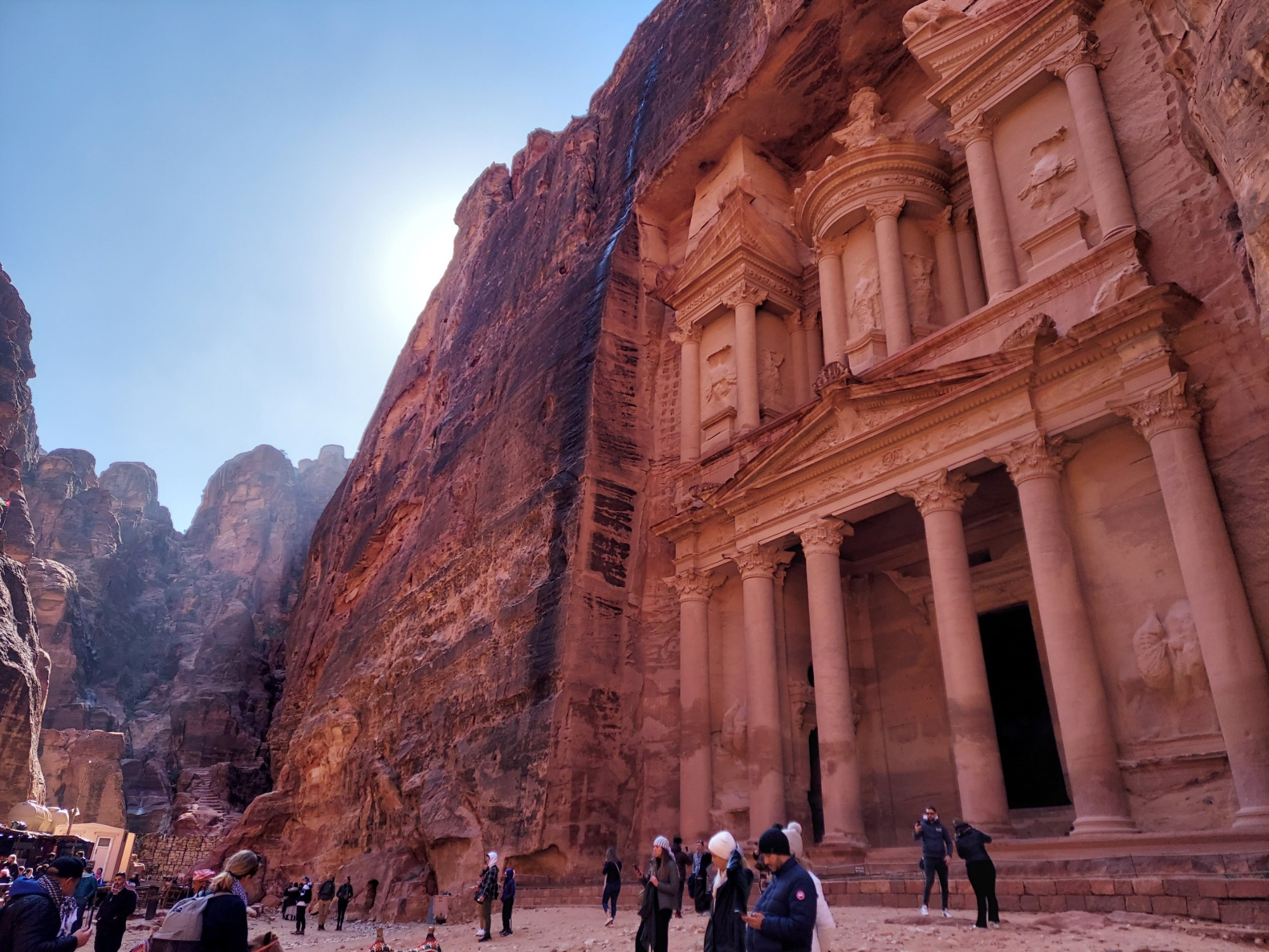 The Treasury — a temple carved into red sandstone cliffs by the ancient Nabataen Kingdom in the Jordanian desert, in Petra, Jordan