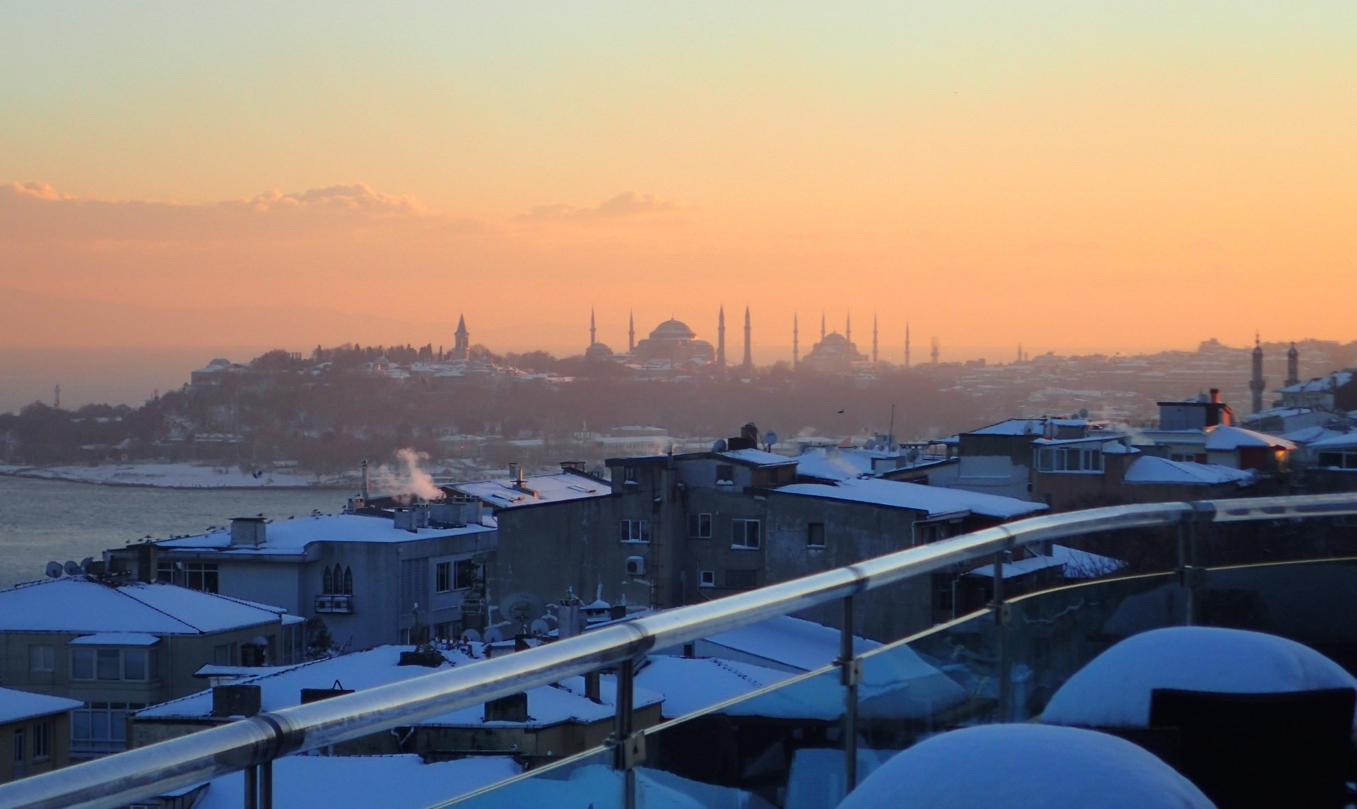 Winter sunset over the grand domes of Hagia Sophia, Topkapi Palace, and the Blue Mosque in Istanbul's old city, Turkiye