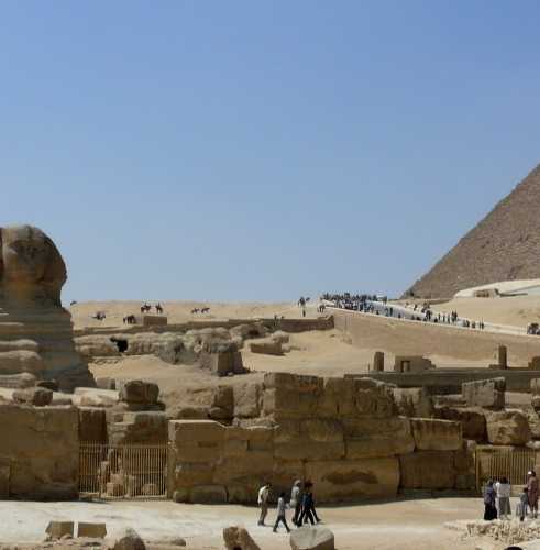 The two largest Great Pyramids of Cheops and Chefren behind the Sphinx — the oldest and grandest of the ancient 7 wonders of the world, in Gize, Egypt
