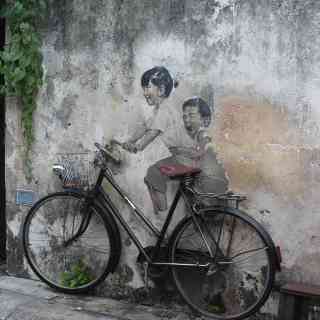 Boy and Girl on Bicycle photo
