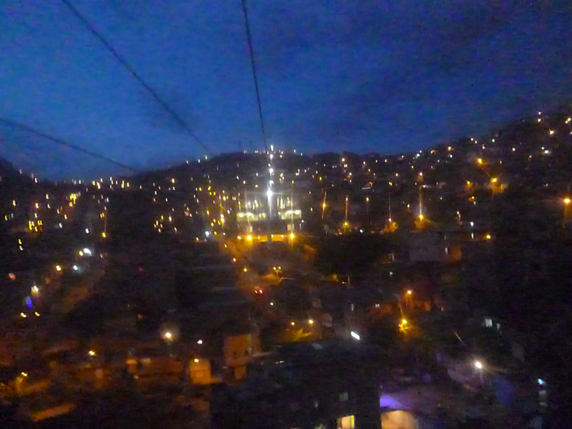 Nightime view over city from cable car