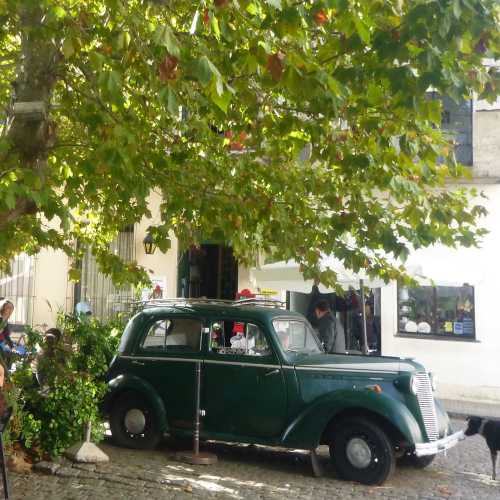 Old car outside cafe