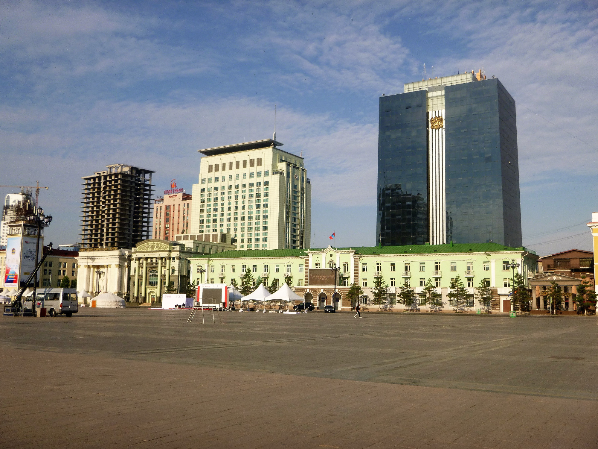 Rear Black Glass Building Khangarid Palace<br/>
Forefront Ulaanbaatar city governent office