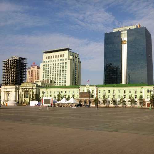 Rear Black Glass Building Khangarid Palace<br/>
Forefront Ulaanbaatar city governent office