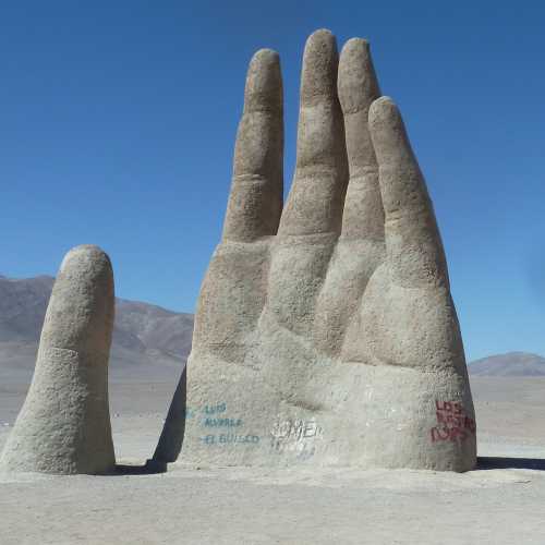 36-ft. sculpture by a Chilean artist shaped like a raised hand coming out of the deser