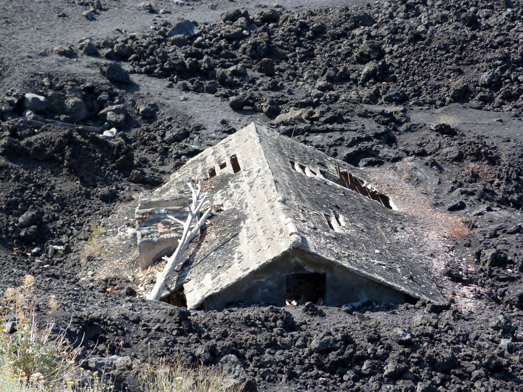 House covered by previous eruption