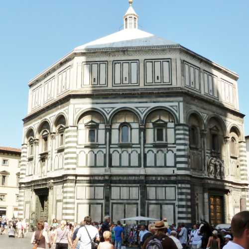 The octagonal baptistery stands in both the Piazza del Duomo and the Piazza San Giovanni, across from Florence Cathedral 