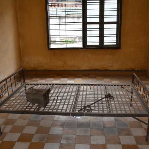 Cell prisoner chained to bed frame