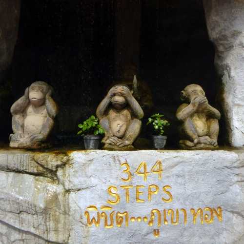 three wise monkey figures