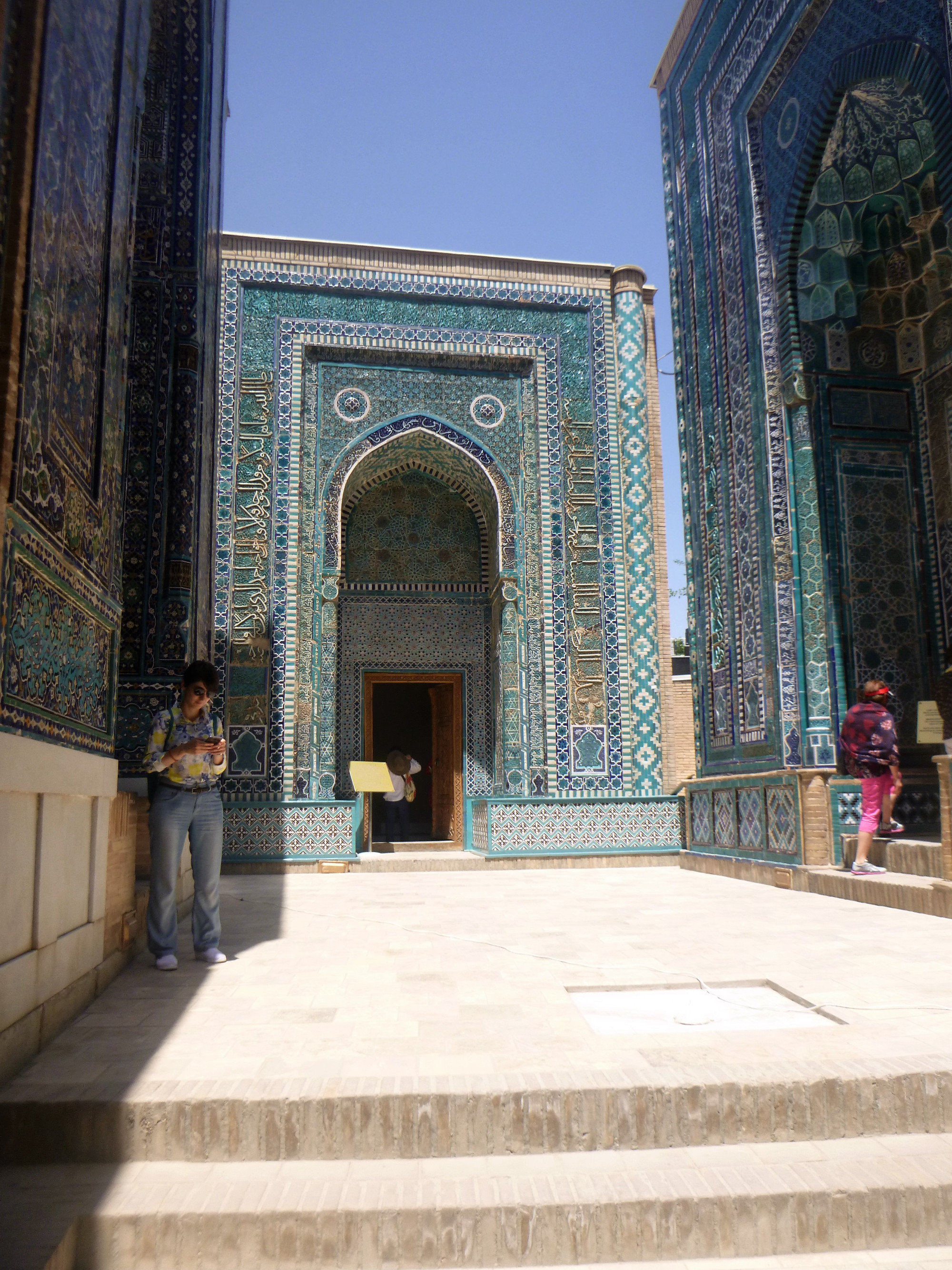 mosaic-tiled mausoleums.