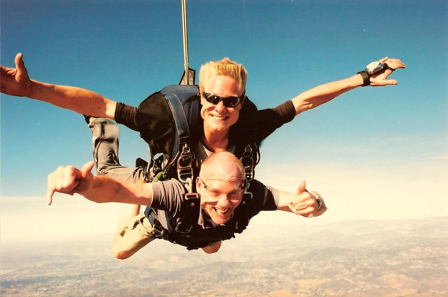 Moi Strapped to surfer dude tandem parachute jump