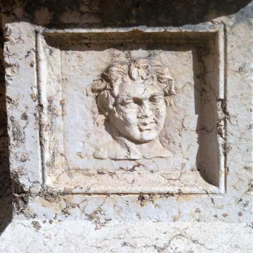Carved relief on water basin
