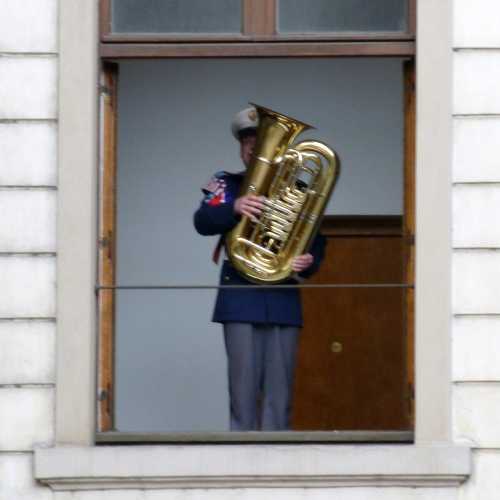 band member playing through Palace window at Changing of the Guard