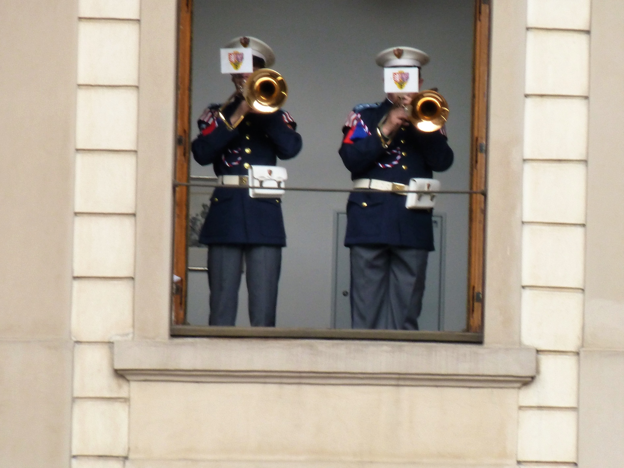 band members playing through Palace window at Changing of the Guard
