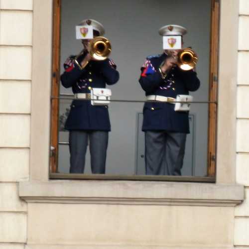 band members playing through Palace window at Changing of the Guard